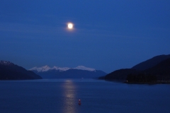 Near full moon rising over Gastineau Channel