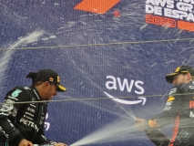 Lewis Hamilton, left, and Max Verstappen celebrating their podium places.